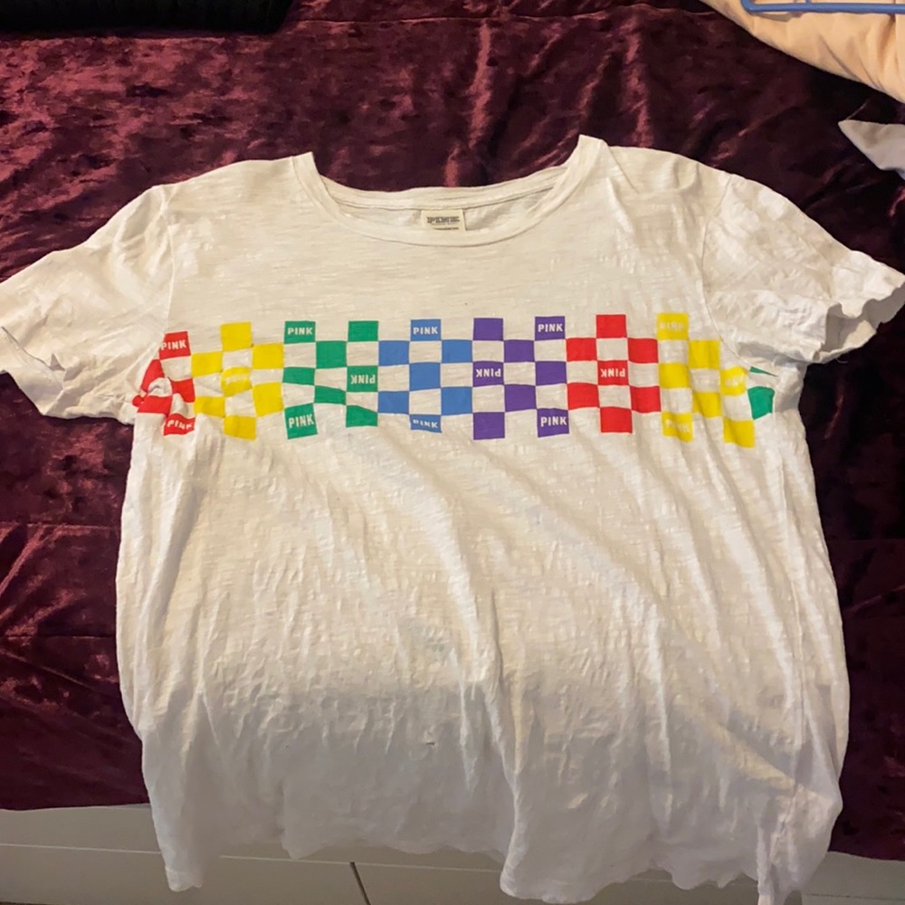 Pink rainbow shirt. Worn and small hole on neck.
